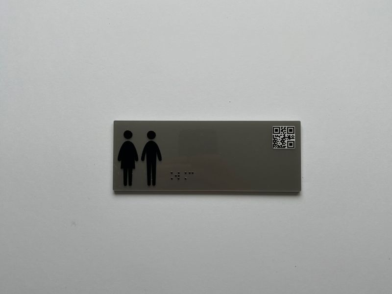 Metalowa tabliczka informacyjna w brajlu z wypukłym piktogramem Metalowa tabliczka informacyjna w brajlu z wypukłym piktogramem